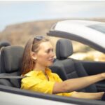 young girl driving a car